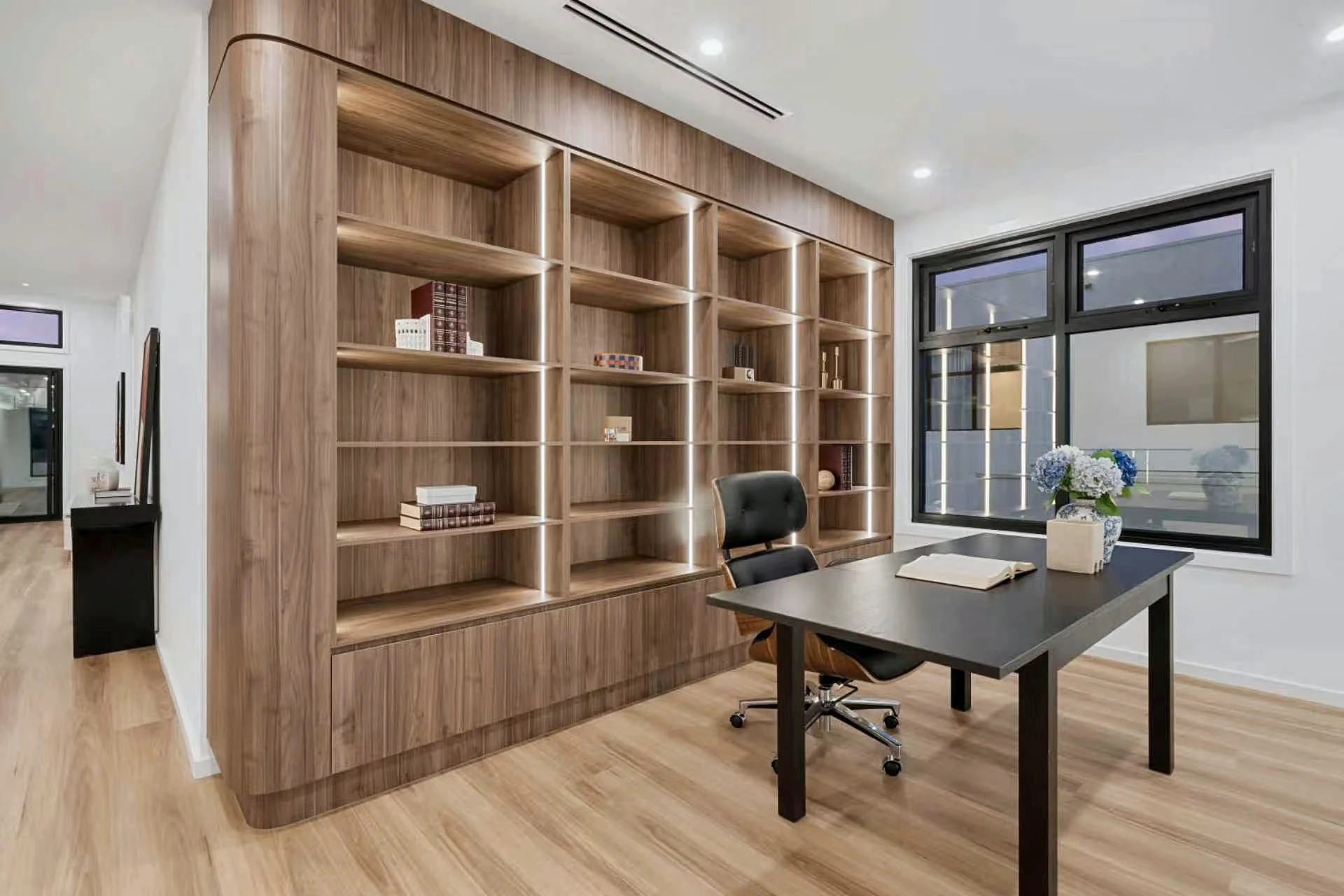 Timber study cabinetry with integrated shelving and a built-in desk