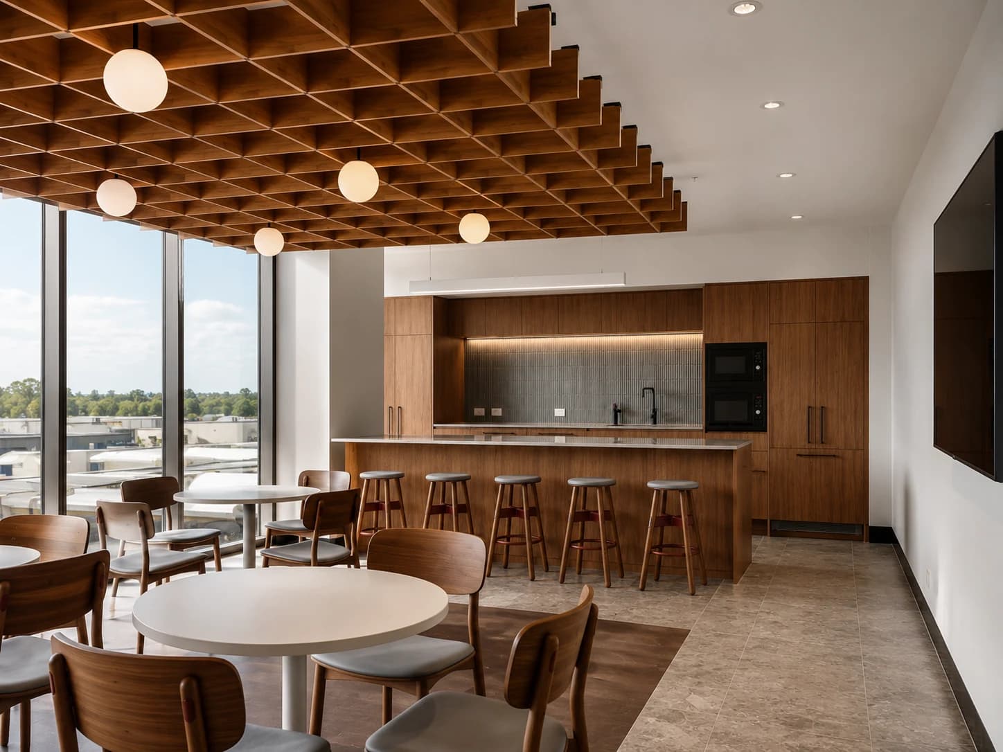 Commercial staff area with integrated cabinetry and timber finishes