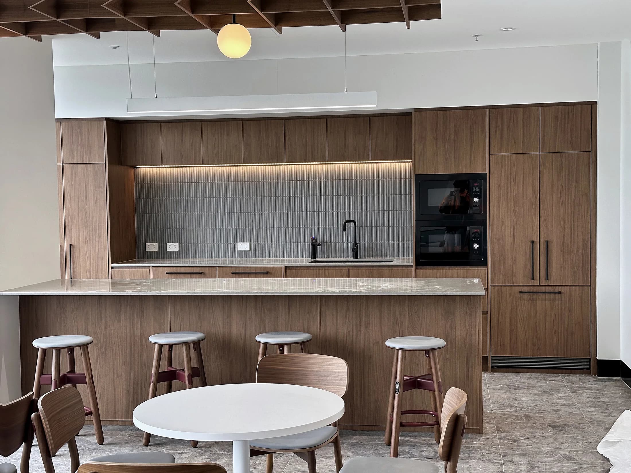 Timber staff kitchen and storage joinery in a commercial interior